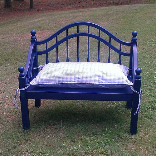 Woodworking by Dana.  One of his latest... A little bench made from a twin bed headboard & footboard.  By Katrina added a blue & white check pillow with ties. $200.00