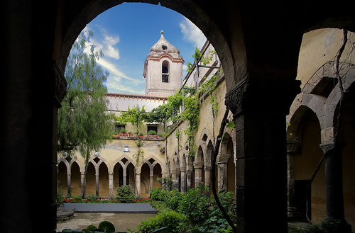 Middle ages St. Francis cloister with hanging vines and flowers