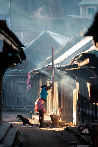 Woman pounding rice