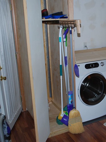 retractable broom rack