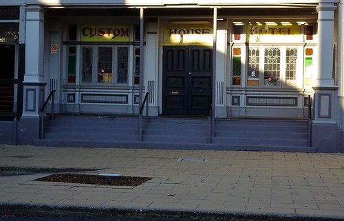 Maryborough. Entrance to Customs House Hotel. Built in 1868 and then extended in 1870 when the Gympie goldfields were going. Extended again in 1883 and Art Deco stained glass windows added in early 20th century.