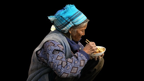 China – Dali – Old Woman Eating Noodle Soup – 1d