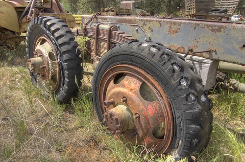 Dual-axle truck chassis with decaying old tires HDR