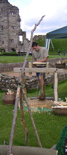 Simple treadle-operated wood turning lathe