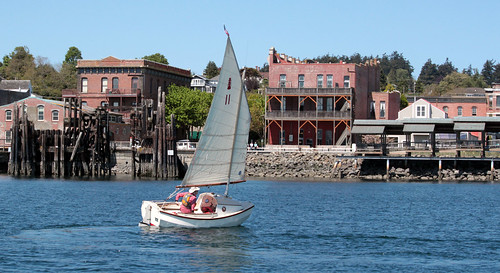 IMG_7562CE - Port Townsend Bay - PTYC Opening Day - aboard BLUE STAR - Port Townsend Pocket Yachter (PTPY)  member Simeon Baldwin with his SCAMP number 11 NODDY reverses course along the waterfront