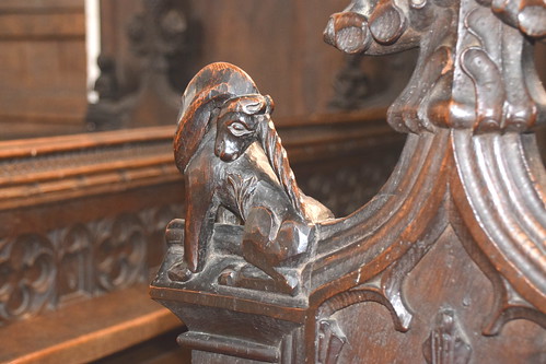 bench end: unicorn scratching its behind (Henry Ringham, C1860)