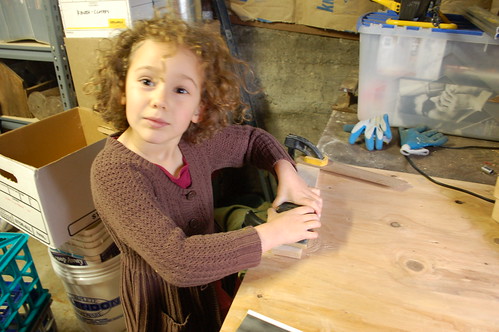 Ellie Sanding a Table Piece