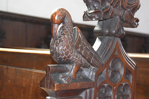 bench end: pelican plucking its breast (Henry Ringham, C1860)