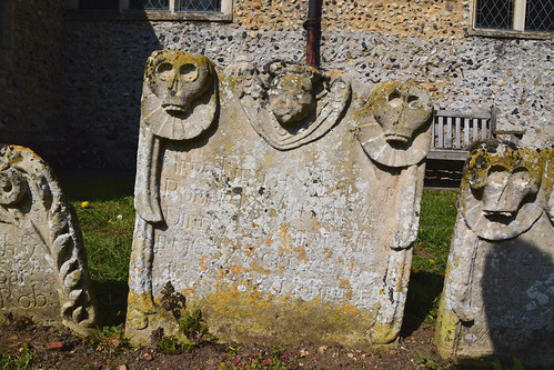 cherub flanked by skulls