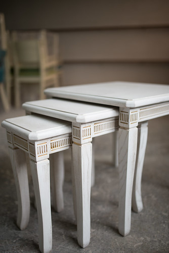 Three beautiful white tables in workshop.