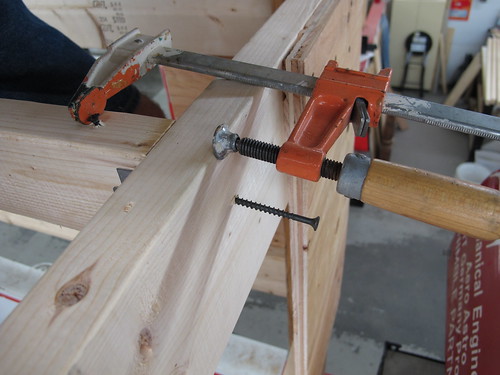 Joist hanger clamping