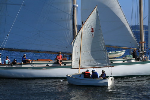 IMG_3918 – Port Townsend WA – NWMC – NWSWBB SCAMP Camp day 6 – Howard Rice and SCAMP #1 – four people in boat and SV MARTHA