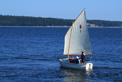 IMG_3919F – Port Townsend WA – NWMC – NWSWBB SCAMP Camp day 6 – Howard Rice and SCAMP #1 – four people in boat