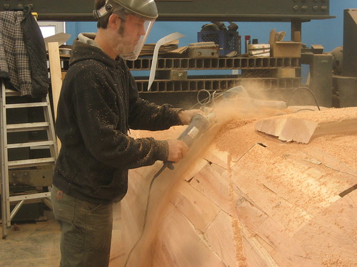 Using a grinder to rough out the body shape