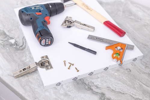 Woodworker Tools for repairing Hinges on the kitchen cabinet doors