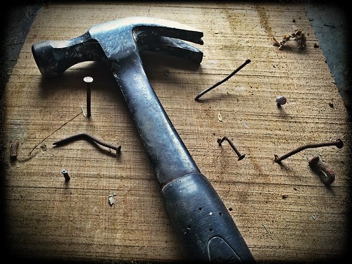 Black Claw Hammer on Brown Wooden Plank - Credit to http://homedust.com/