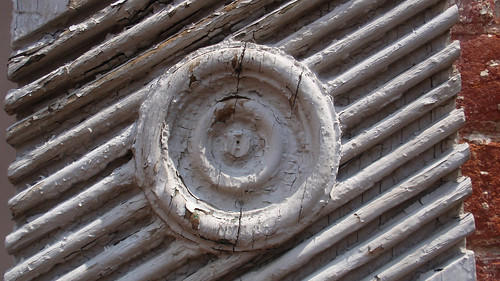 Wood detail on old brick building