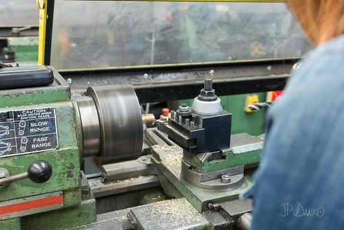 Old gritty lathe in machine shop ready for manufacturing