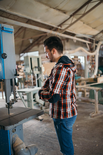 Carpenter standing in his workshop.